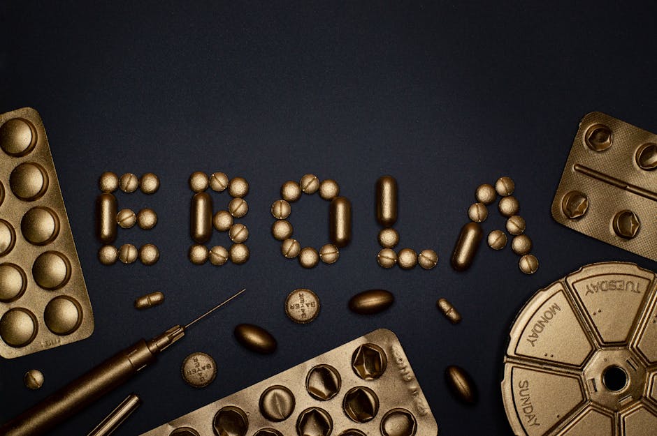 Creative arrangement of pills spelling 'EBOLA', showcasing a conceptual healthcare theme.