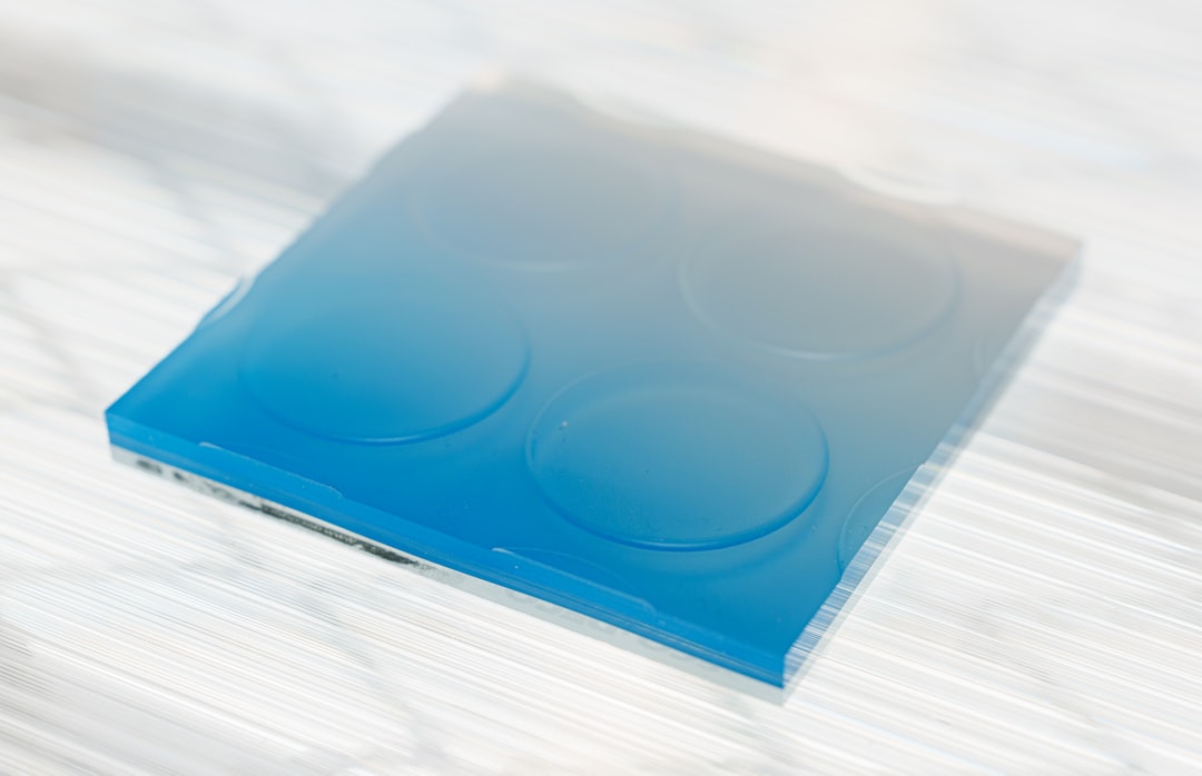 Blue and white square tray with indentations.